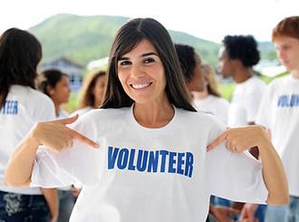 a volunteer woman smling for picture
